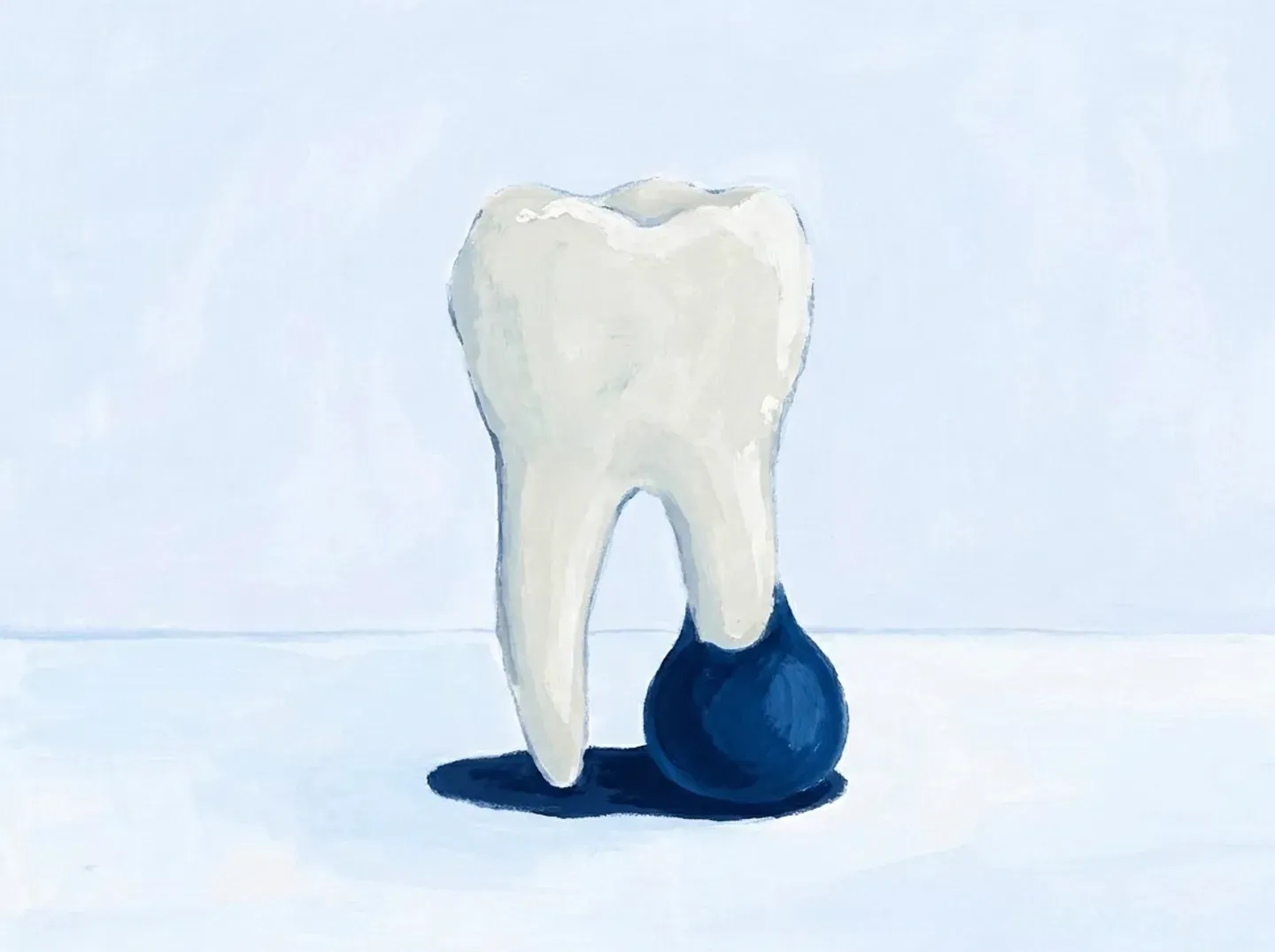 Un molar visto de lado con una bolsa oscura bajo la punta de la raíz
