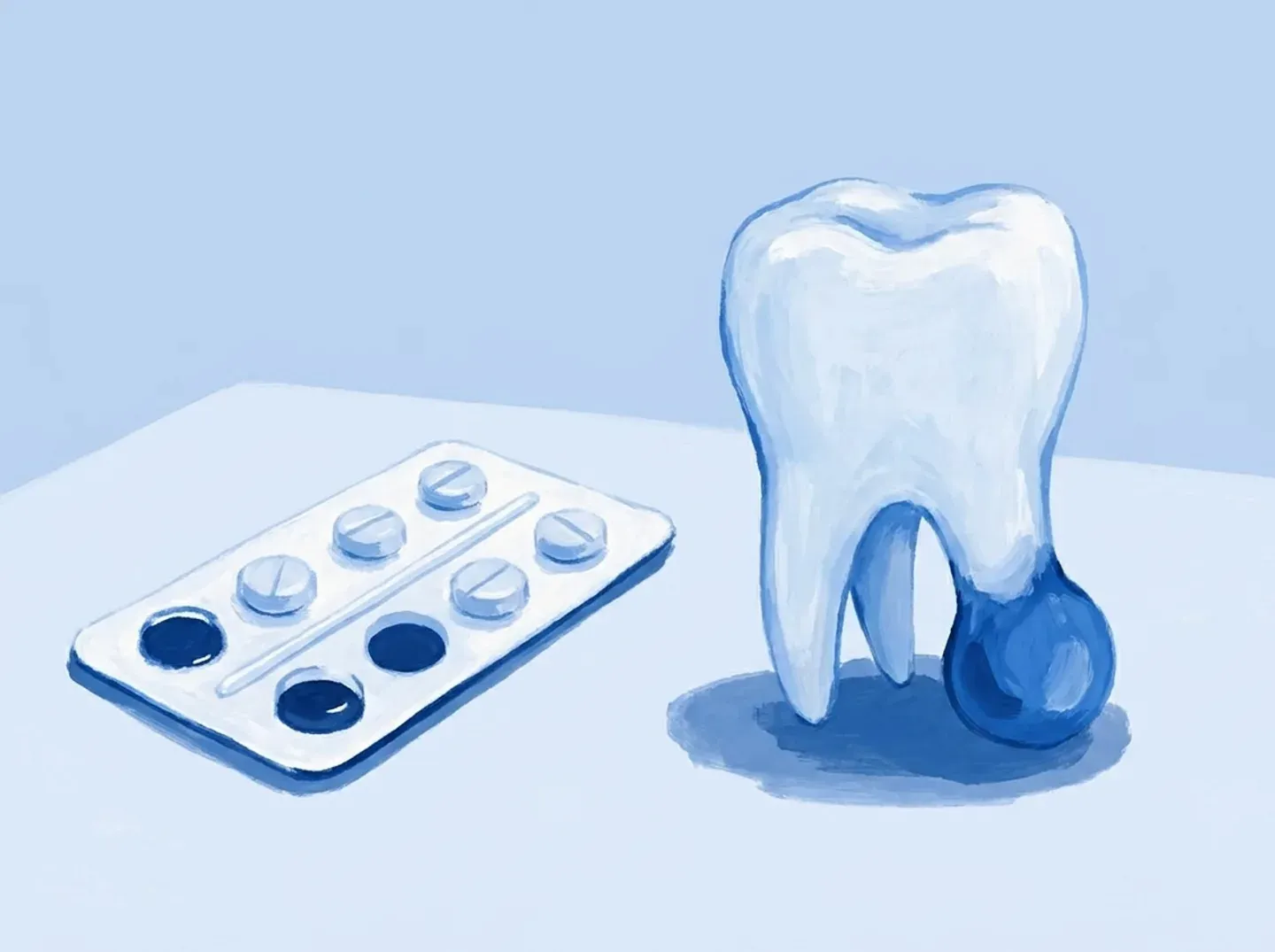 Un blíster de pastillas sobre la mesa y, al lado, la muela con la bolsa aún oscura bajo la raíz